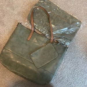 suede forest green bag with wristlet and removable insert. Never used.